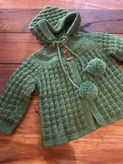 Hand Knitted Hooded Jacket with Pom Poms