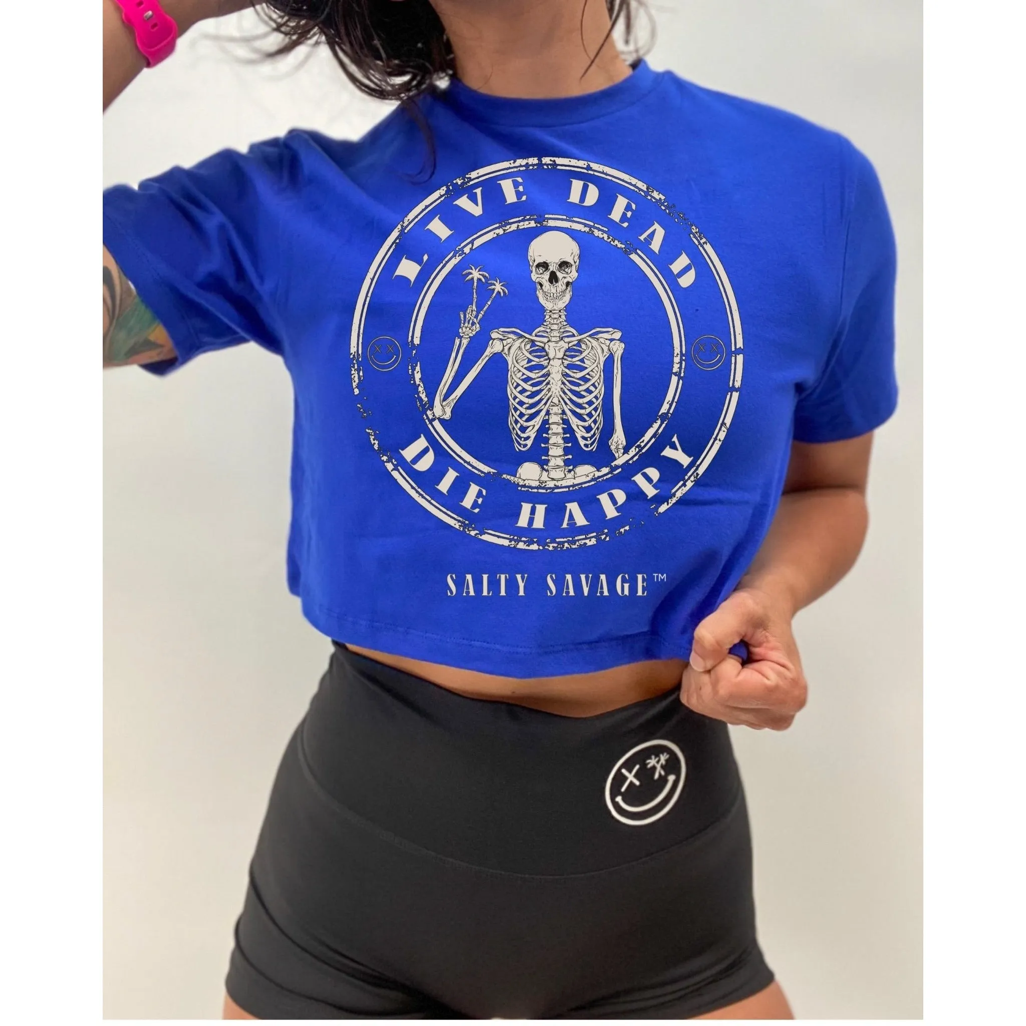 Salty Savage Ladies "LIVE DEAD, DIES HAPPY" Peace Skeleton Crop Tee | Royal Blue